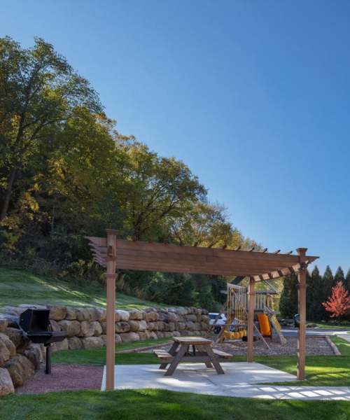 Grilling and picnic area at Mill Creek Apartments in Cross Plains, Wisconsin
