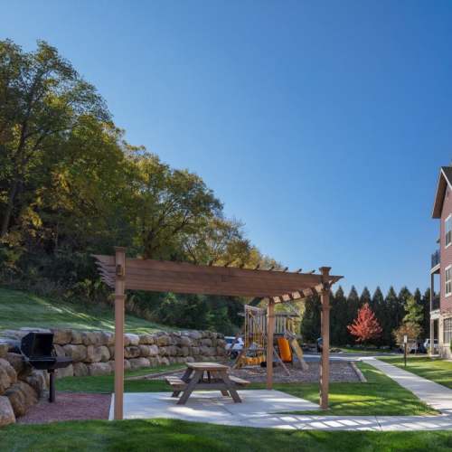 Grilling and picnic area at Mill Creek Apartments in Cross Plains, Wisconsin