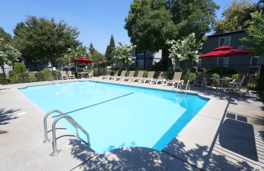 Swimming pool with lounge chairs at Forest Park in Chico, California