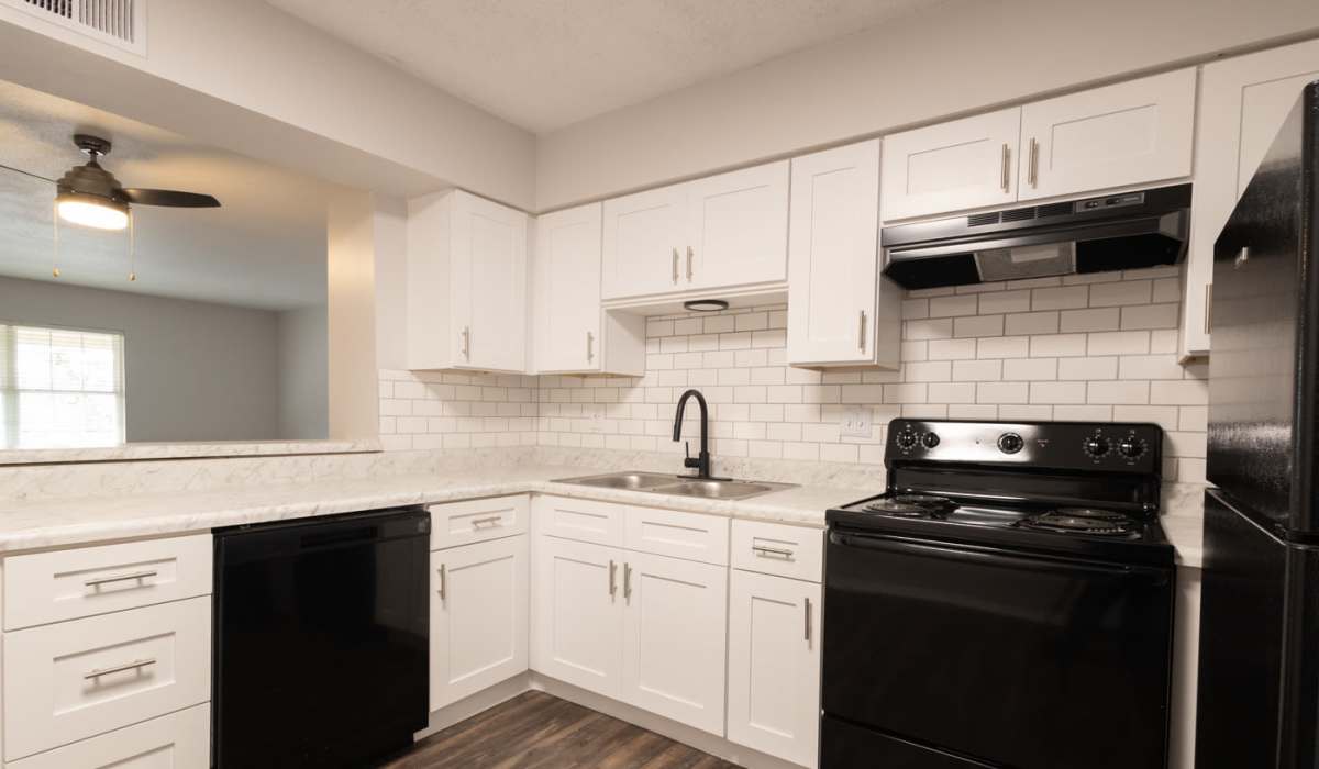 Kitchen with air conditioning and a dishwasher at The Sycamores in Indianapolis, Indiana