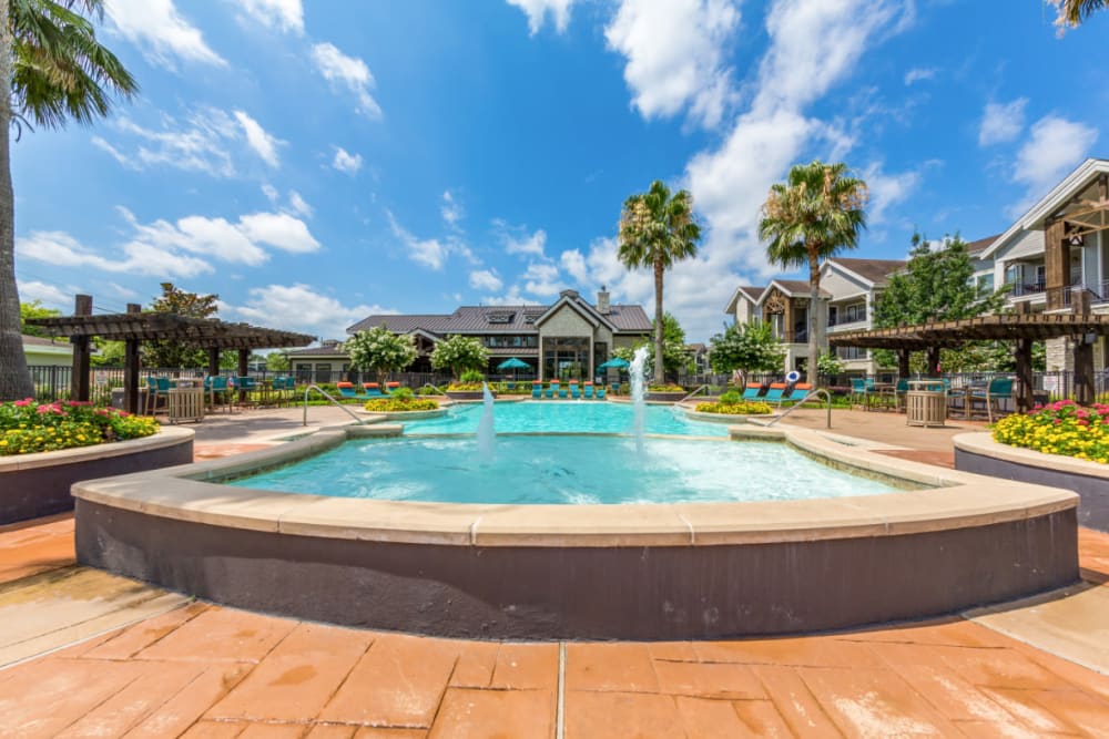 Water feature overlooking pool and clubhouse at Marquis at Sugar Land in Sugar Land, Texas