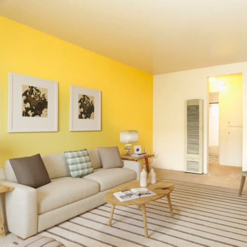 Comfortable living area at Coral Gardens Apartments in Hayward, California