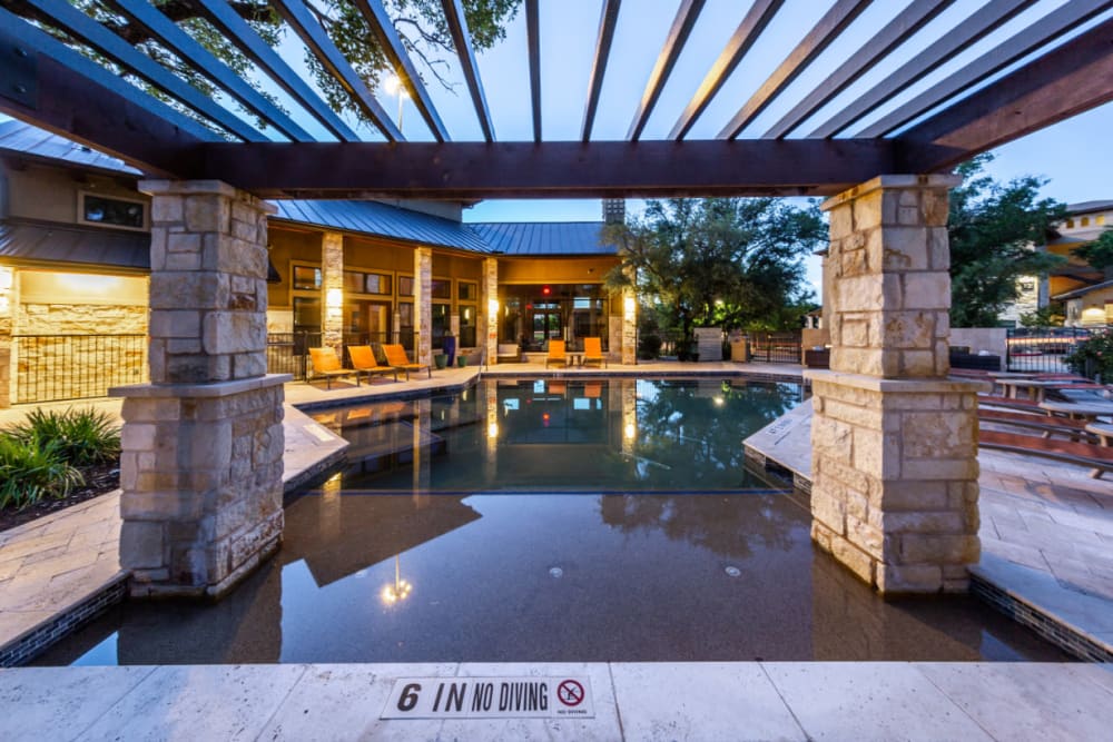 Wading area of pool at sunset at Marquis at Barton Trails in Austin, Texas