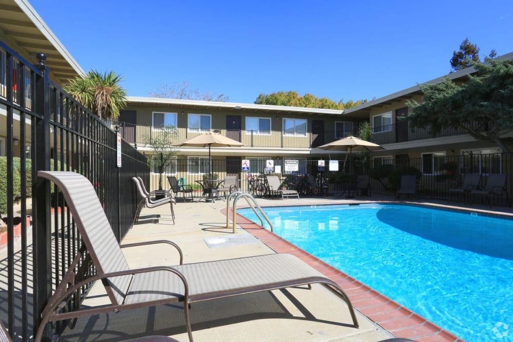 Loounge chairs by the pool at Royal Gardens Apartment Homes in Livermore, California