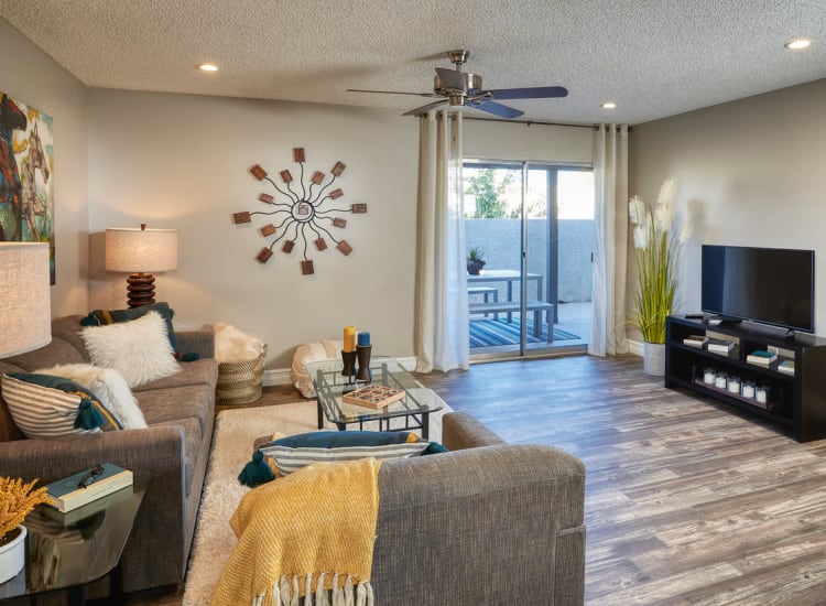 Beautifully decorated living space with hardwood floors in one of Fort Family Investments's corporate housing units in Jacksonville, Florida