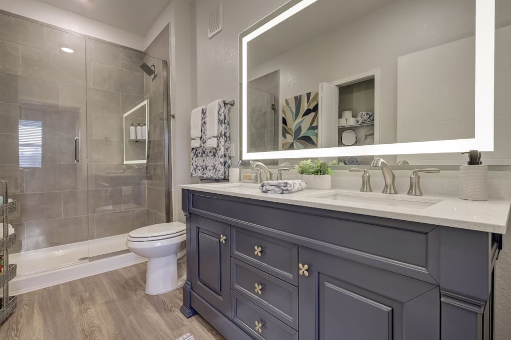 Modern bathroom with double vanity at Coconut Pointe in Estero, Florida