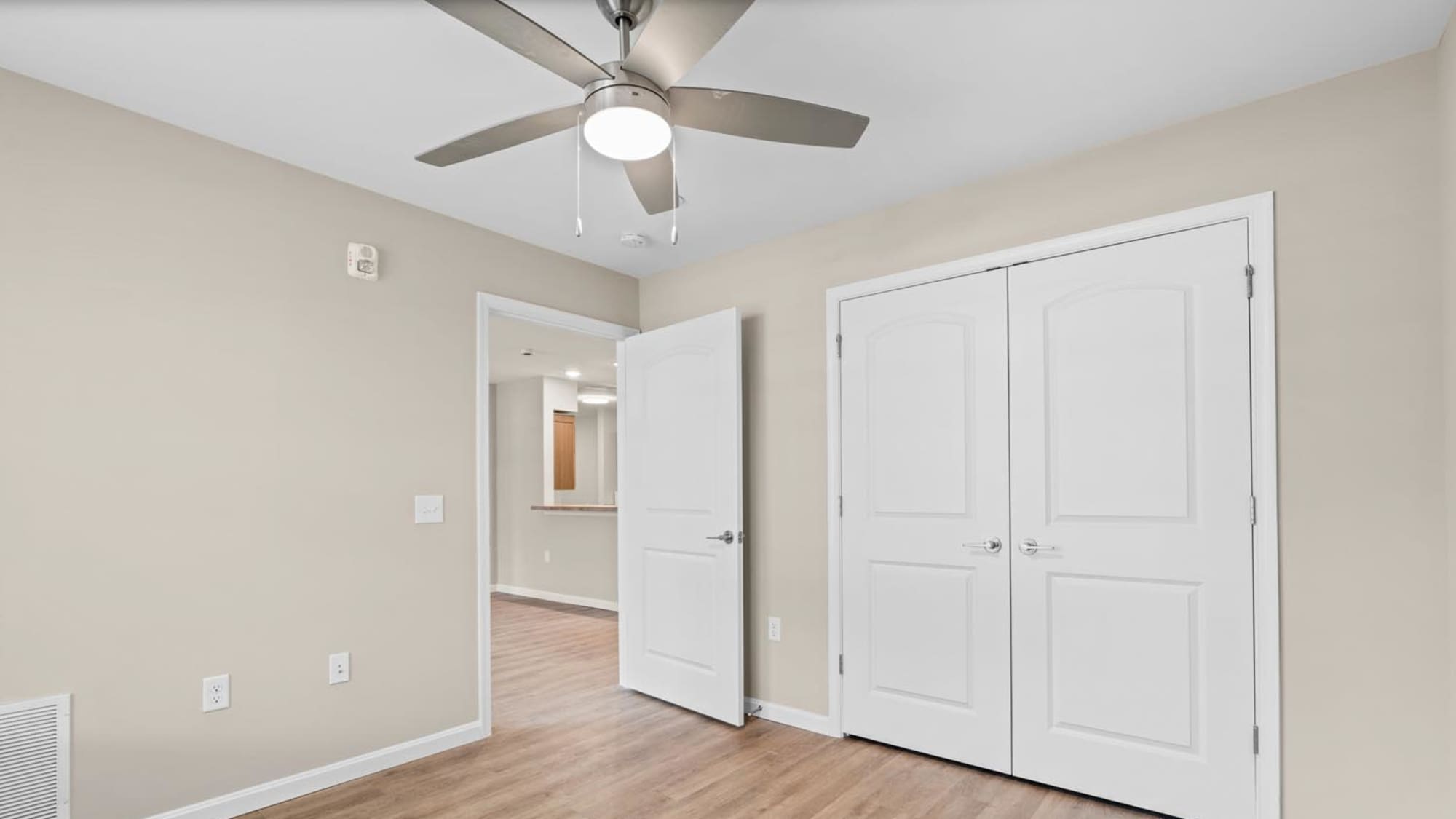 Bedroom with white accents and ceiling fan Millersview Crossing in Millersville, Maryland