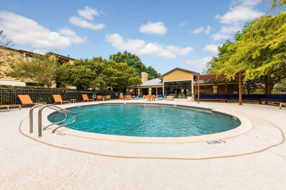 Round pool with lounge chairs and gazebo at Marquis at Barton Trails in Austin, Texas