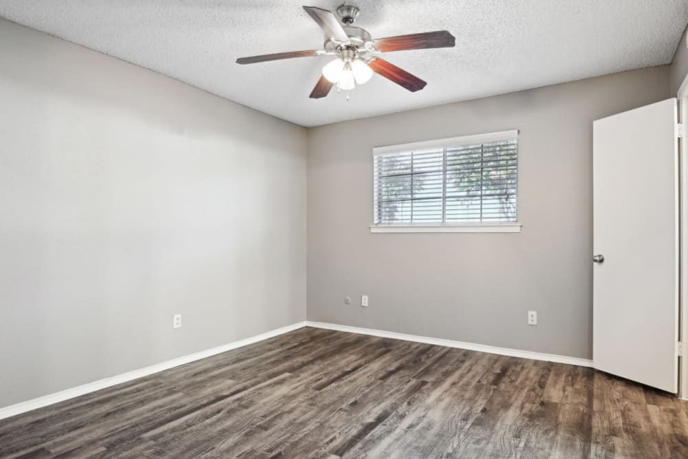 Spacious and well-lit bedroom at Courts of Bedford in Bedford, Texas
