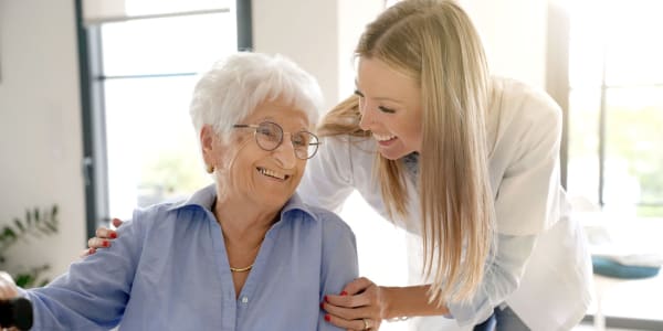 Resident getting support from the onsite nurse at Geneva Lake Manor in Lake Geneva, Wisconsin