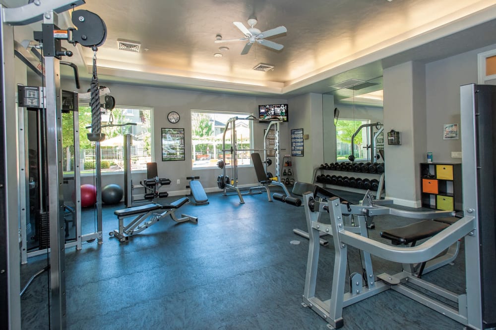 Fitness center with plenty of individual workout stations at The Artisan Apartment Homes in Sacramento, California