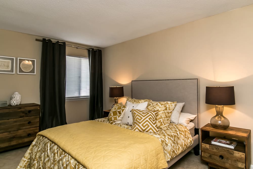 Spacious carpeted model bedroom at Forestbrook Apartments and Townhomes in West Columbia, South Carolina