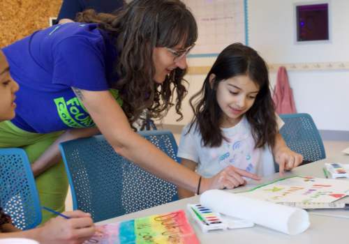 Resident child reading at Parker Lane Apartments in Austin,Texas 