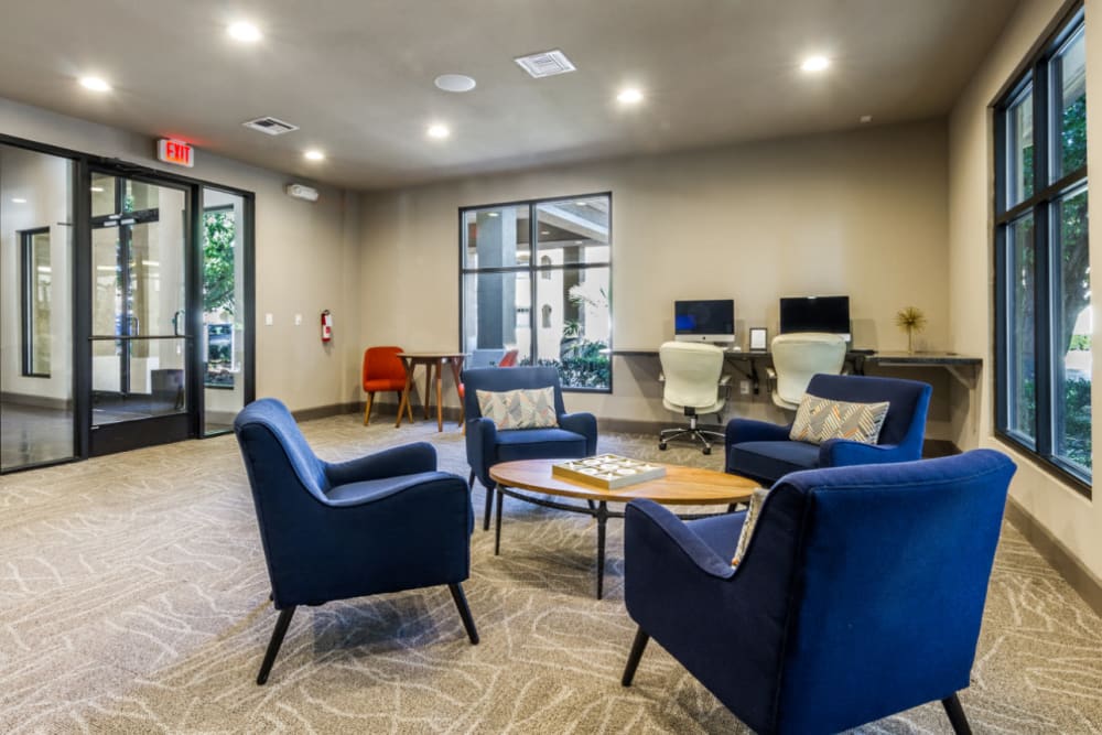 Business center with seating area in community lounge at Marquis at Barton Trails in Austin, Texas