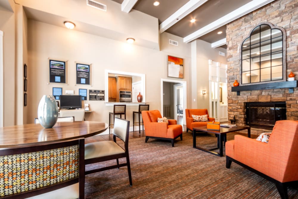 Community clubhouse sitting area with kitchen area at Marquis at Sugarloaf in Duluth, Georgia