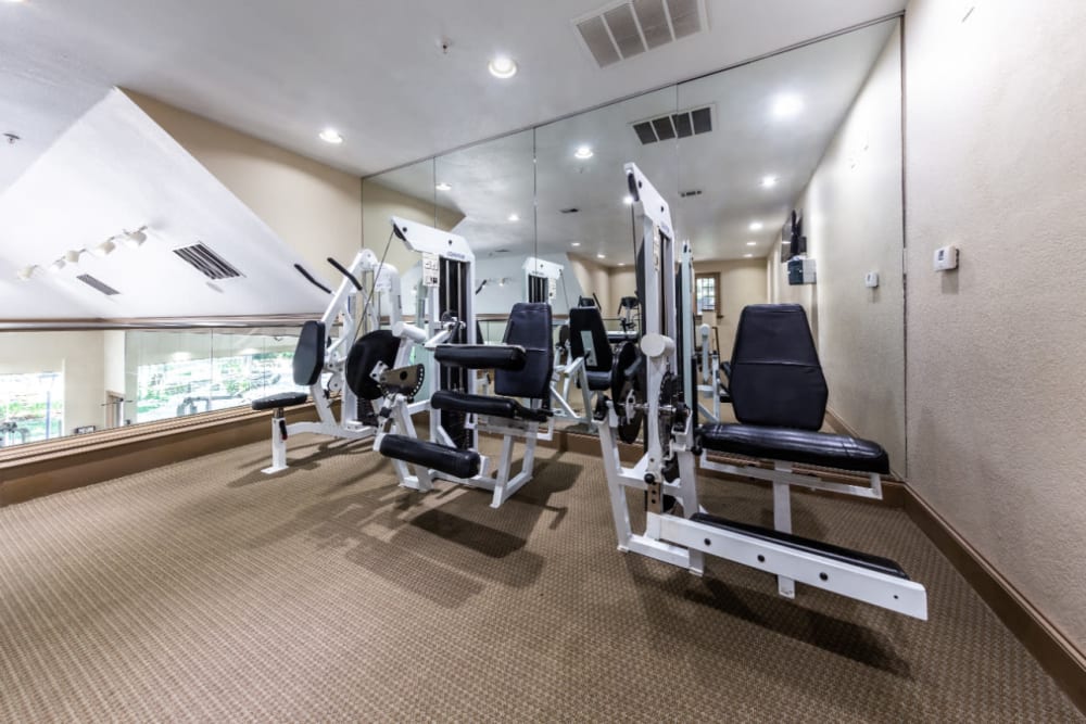 Weight assisted machines in upstairs section of fitness room at Marquis at Waterview in Richardson, Texas