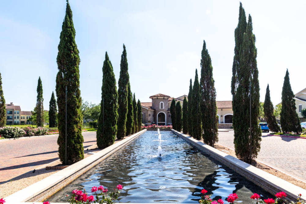 Main property entrance with water feature in center at Marquis at the Reserve in Katy, Texas