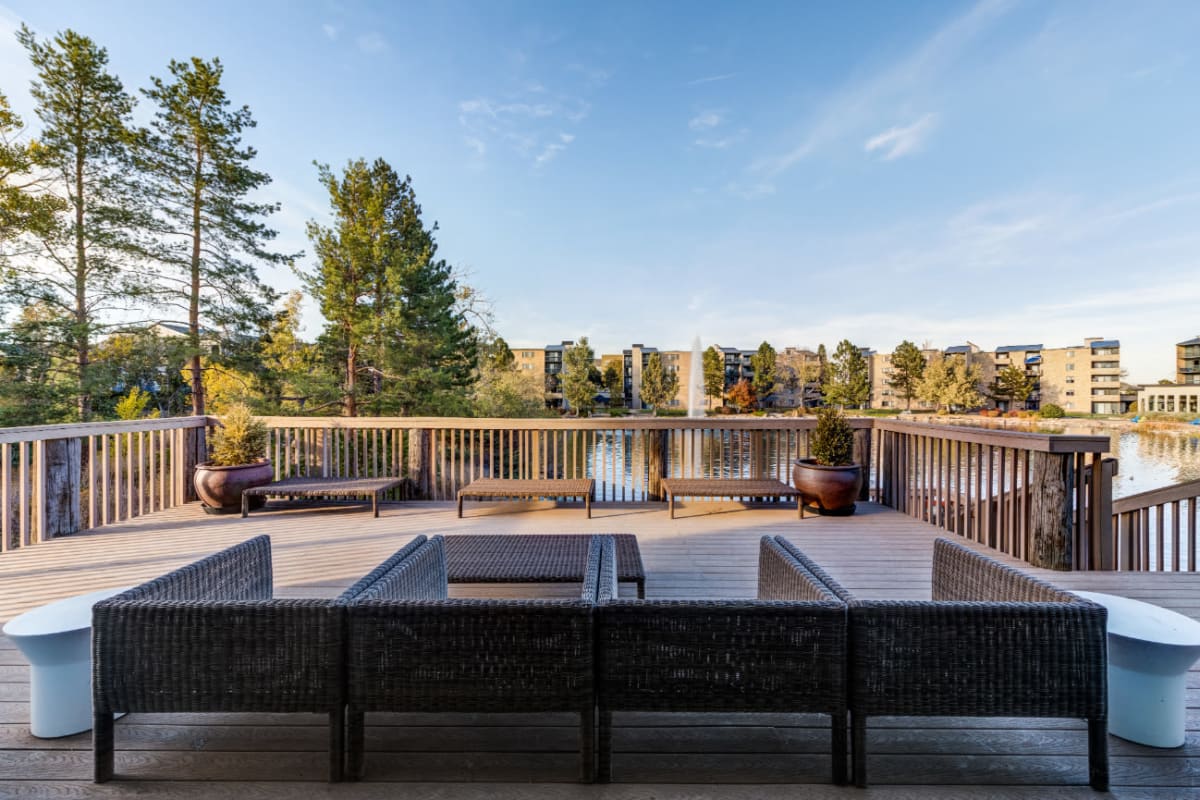 Outdoor sitting area overlooking lake at Ashford Belmar in Lakewood, Colorado