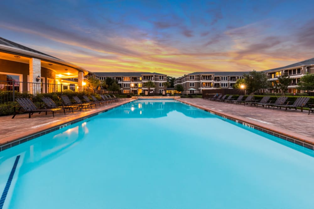 Sparkling pool at sunset at Marquis at The Cascades in Tyler, Texas
