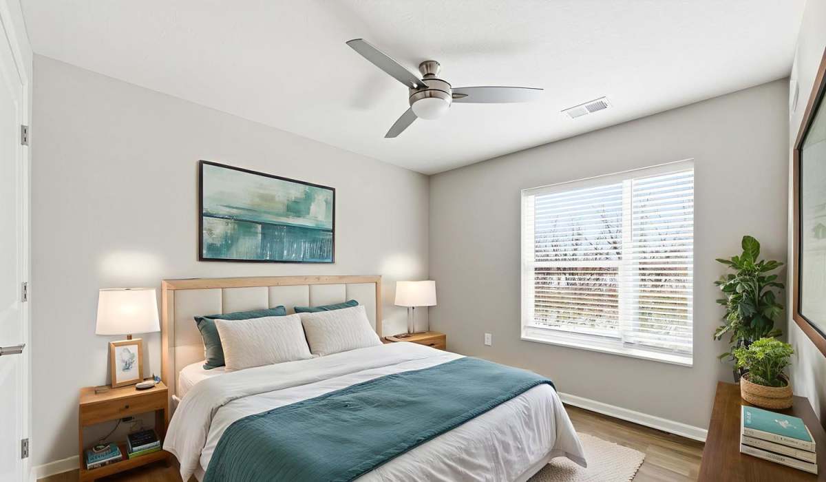 A modern bedroom with a blue color palatte at Granville Woods Lofts II in Columbus, Ohio
