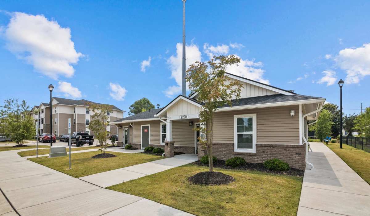 A wide exterior view of the apartment homes at Old Firetower Place in Greenville, North Carolina
