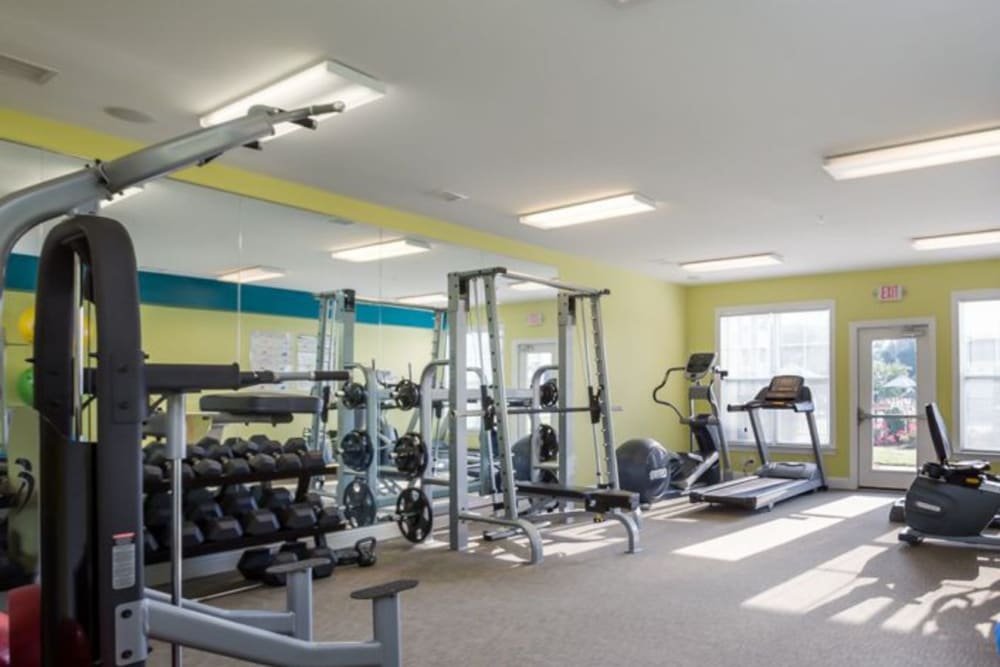Fitness room with strength training machines, free weights, and exercise bike at 29 North in Hickory, North Carolina