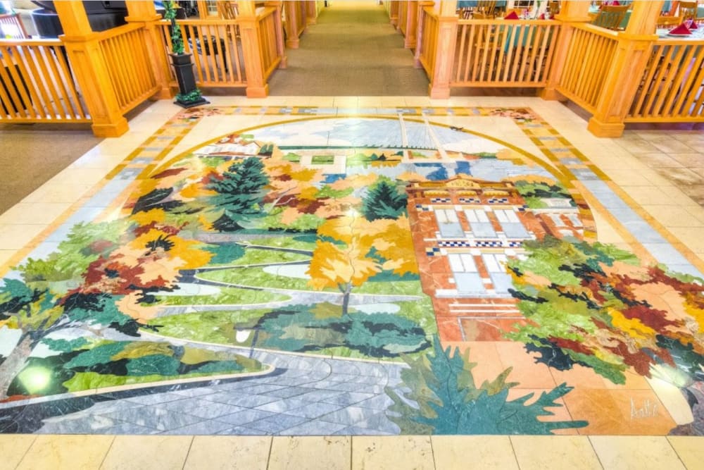 Closeup of lobby tile mosaic at Addington Place of Burlington in Burlington, Iowa