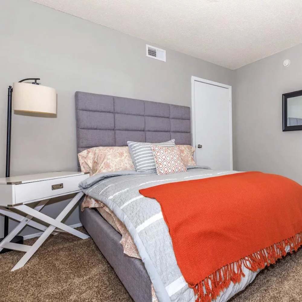 Bedroom with overhead lighting at Barcelo Apartment Homes in San Antonio, Texas