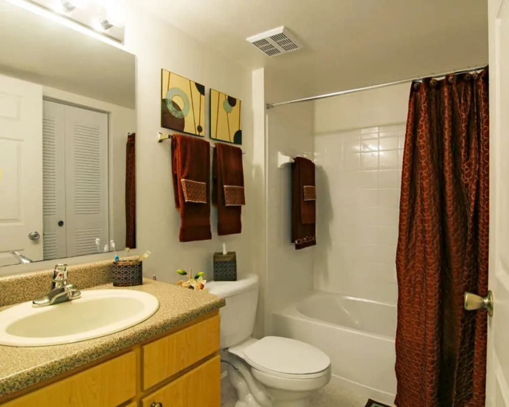 Bathroom with tub at  San Marco Apartments in Ormond Beach, Florida