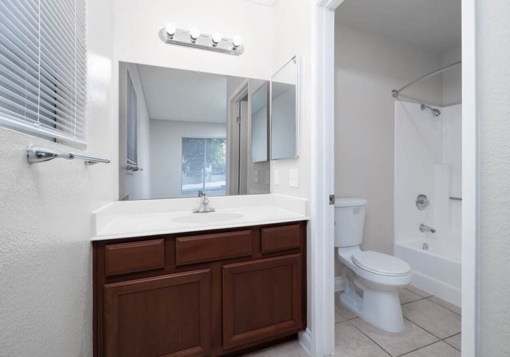 Bathroom with a large mirror at Shadowridge Summerwind in Vista. CA