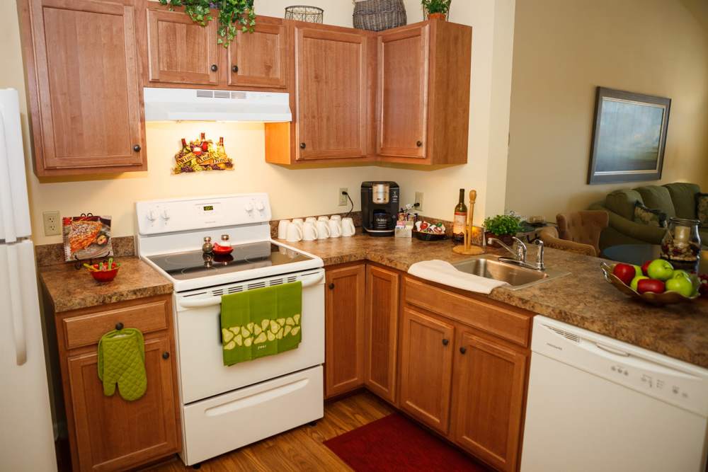Kitchen with modern white appliances at Harmony at Falls Run in Fredericksburg, Virginia