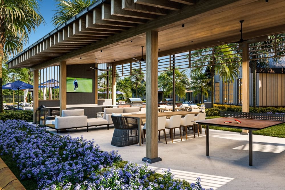 Covered outdoor recreational space with ping pong and flatscreen tv at The Murray in Summerville, South Carolina