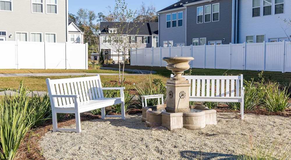 Fountain surrounded by benches and landscaping near Chamberlain Pines in Summerville, South Carolina