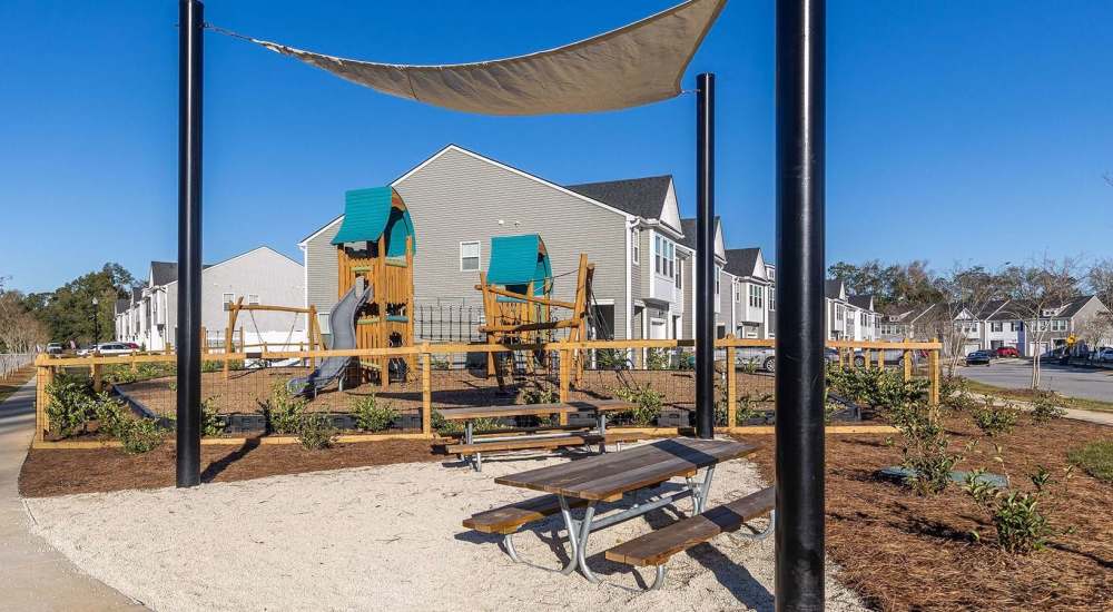 Playground structure with slide and shade sail at Chamberlain Pines in Summerville, South Carolina