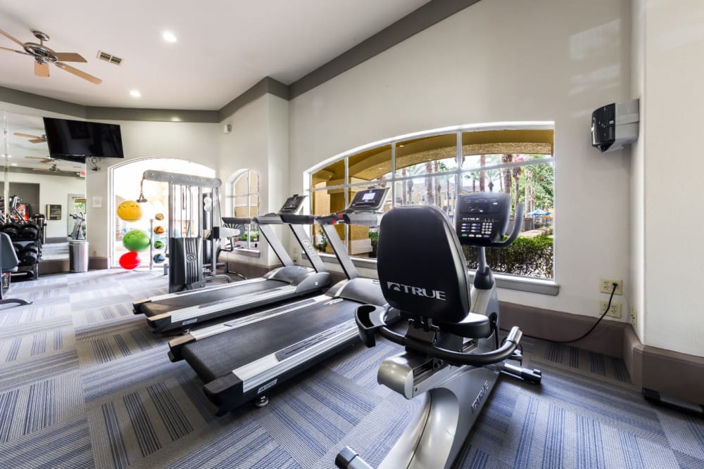 Cardio machines in the fitness center at Marquis at Clear Lake in Webster, Texas