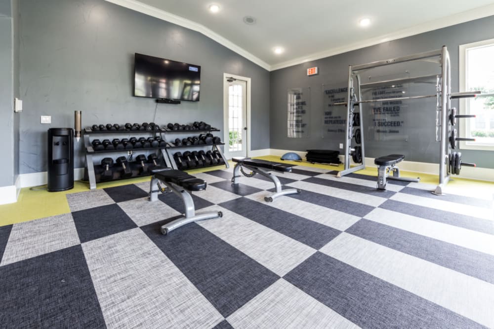 Free weight section of fitness room at Marquis at The Cascades in Tyler, Texas