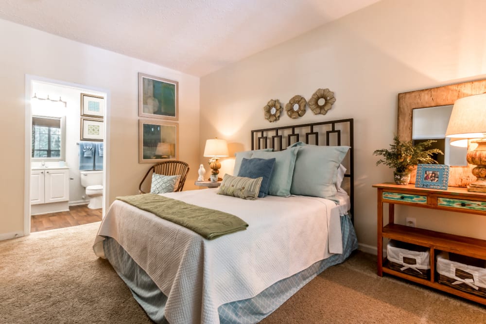 Spacious carpeted bedroom with private bathroom at Marquis at Sugarloaf in Duluth, Georgia