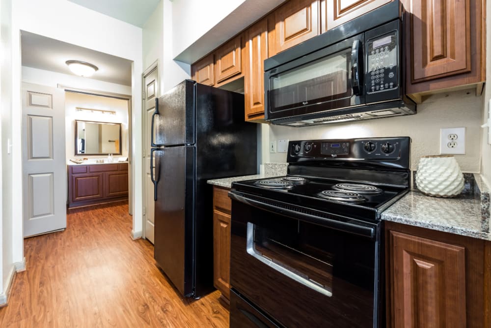 Pass through area of kitchen towards bathroom at Marquis on Park Row in Houston, Texas