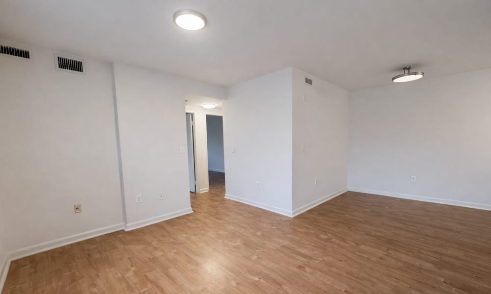 Unfurnished living room with wood flooring at Weinberg Commons in Washington, District of Columbia