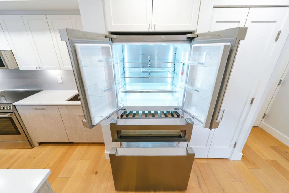 Stainless-steel fridge with open doors at 28 Exeter at Newbury in Boston, Massachusetts