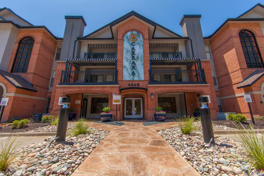 Front entrance to the community building at Carrara at Cole in Dallas, Texas