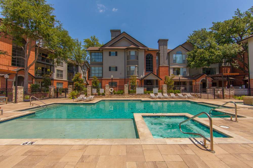 Swimming pool with hot tub at Carrara at Cole in Dallas, Texas