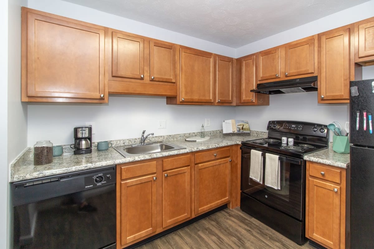 Model kitchen with granite countertops at The Hermitage in Speedway, Indiana