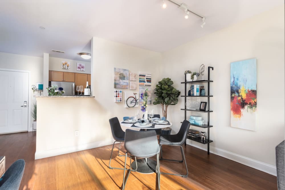 A soft lit living area with hardwood floors at Parkside Commons in Chelsea, Massachusetts