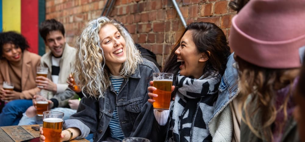 Residents laughing at a local pub near Cascade Ridge in Tacoma, Washington