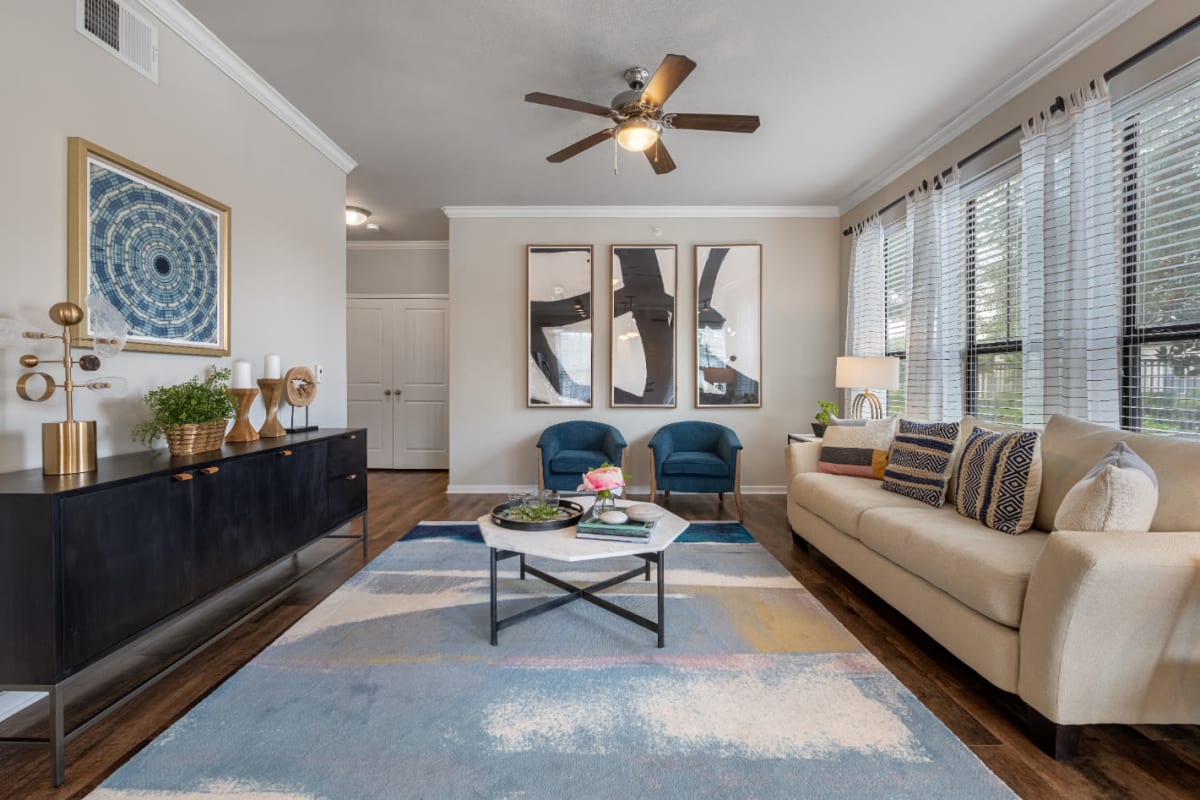 Spacious and bright living area with large windows at Marquis at Sugar Land in Sugar Land, Texas
