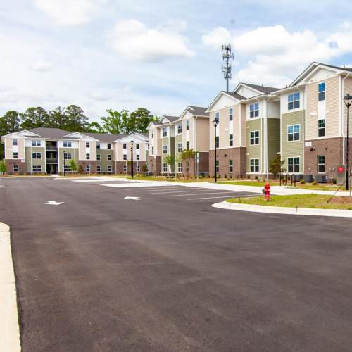 Apartment buildings with parking lot at Palatine Meadows in New Bern, North Carolina