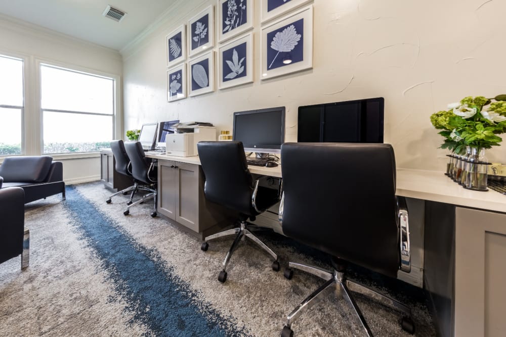 Executive business center with multiple workstations at Marquis at The Cascades in Tyler, Texas