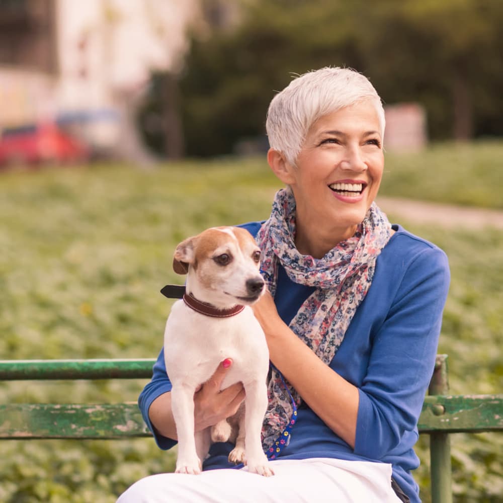 Senior with puppy at Island House Assisted Living in Mercer Island, Washington