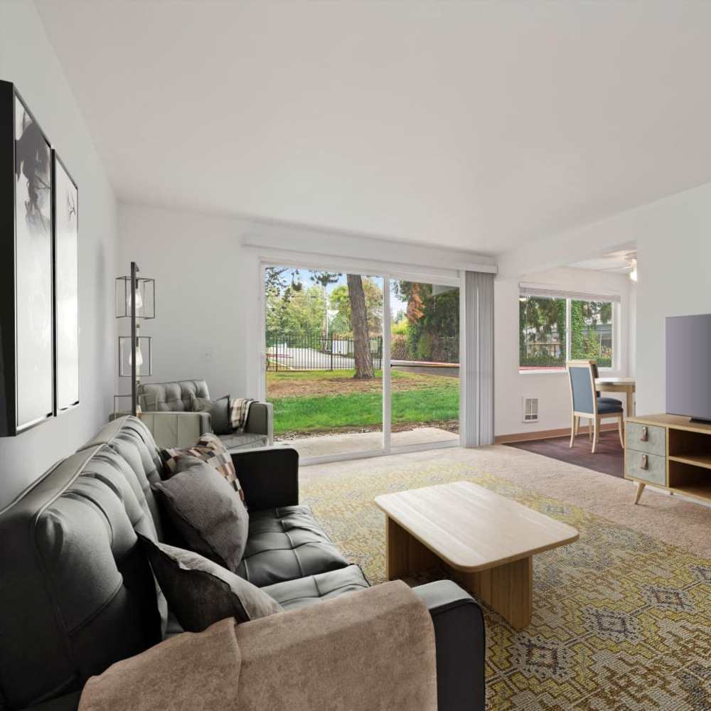 Stylish model living room with courtyard views at Bluffs at Evergreen in Everett, Washington